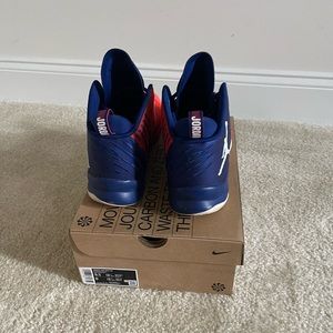 Brand is Jordans. Size 10.5. Color is Orange and Blue.